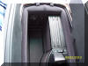 Storage for CD-ROMS and I-Pod hook ups under armrest